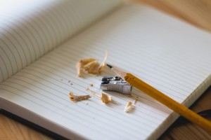 A photo showing notebook, pencil and sharpener, all essential training tools