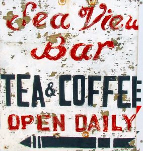 vintage, weathered sign saying Sea View bar, Tea and coffee, open daily