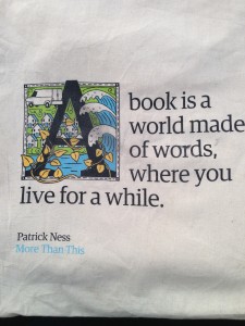 Picture of a quote "A book is a world made of words, where you live for a while."