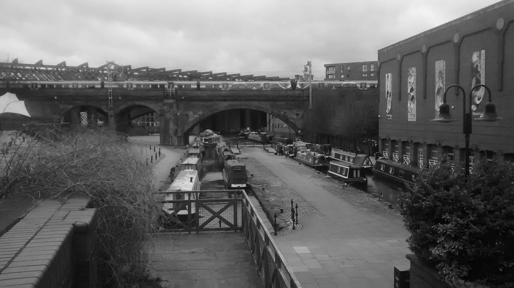black and white photo of Manchester canal and railway