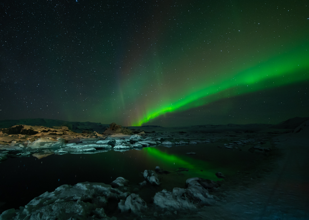 Northern Lights over Jökulsárlón glacial lagoon in Southern Iceland
